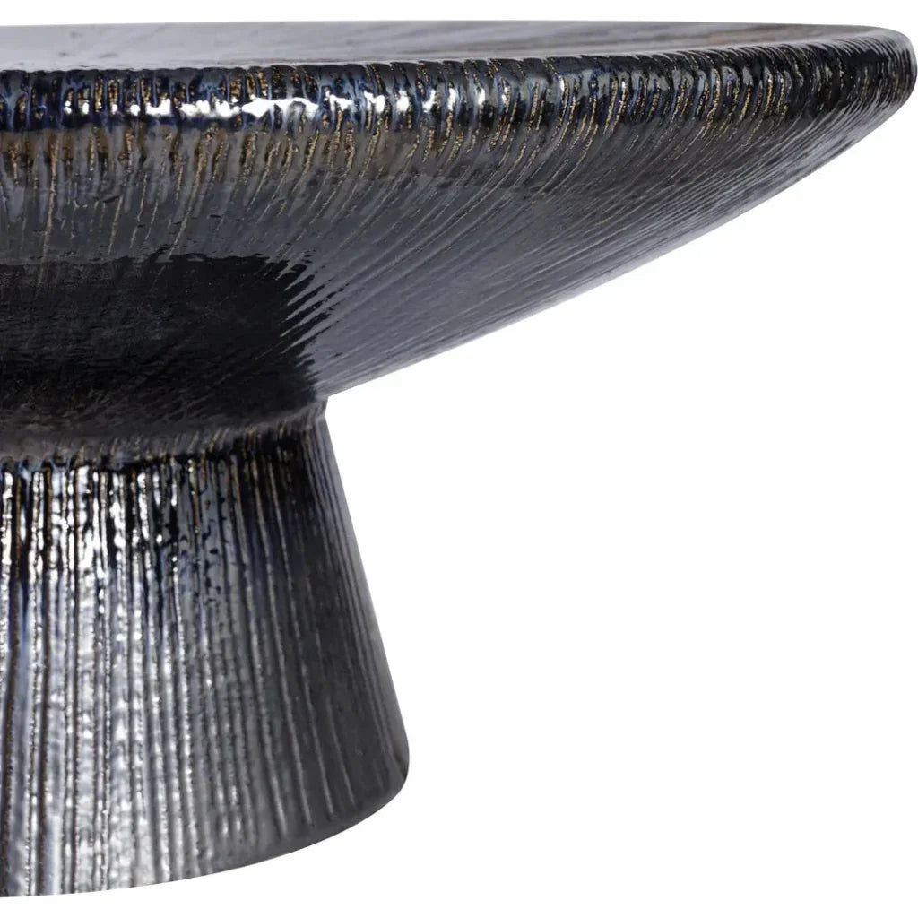 Close-up of a textured black table with a white background