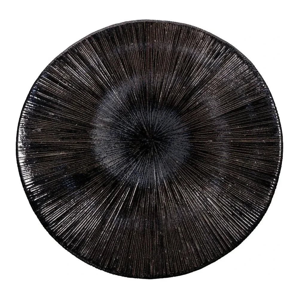 Black decorative coffee table with textured surface on a white background