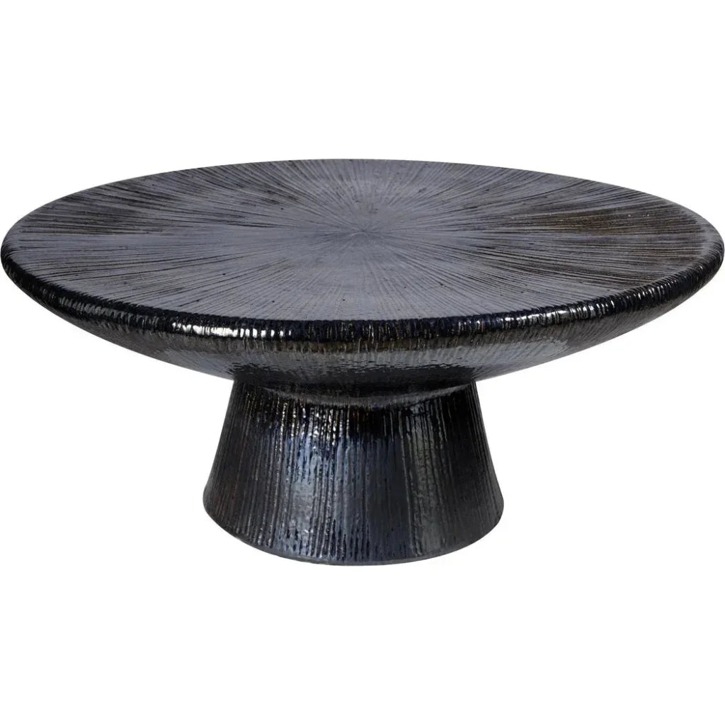 Black textured round table on a white background