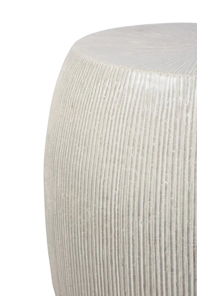 Close-up of a textured white stool on a white background