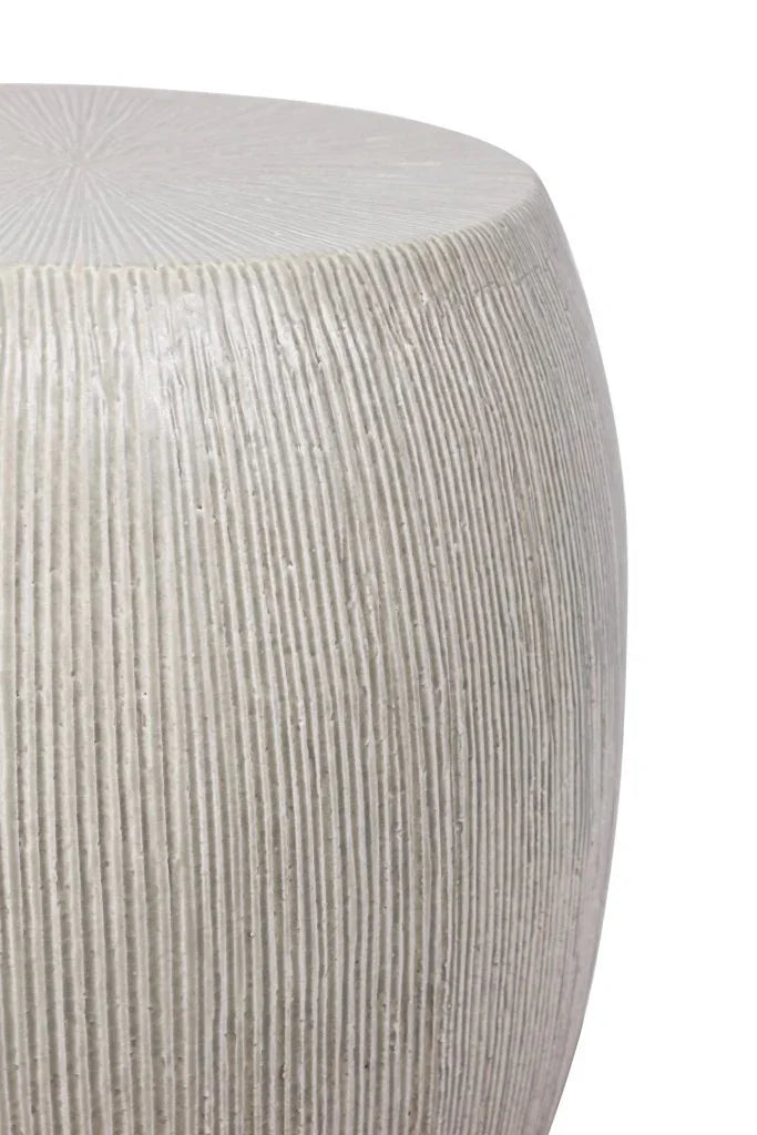 Close-up of a textured white stool on a white background