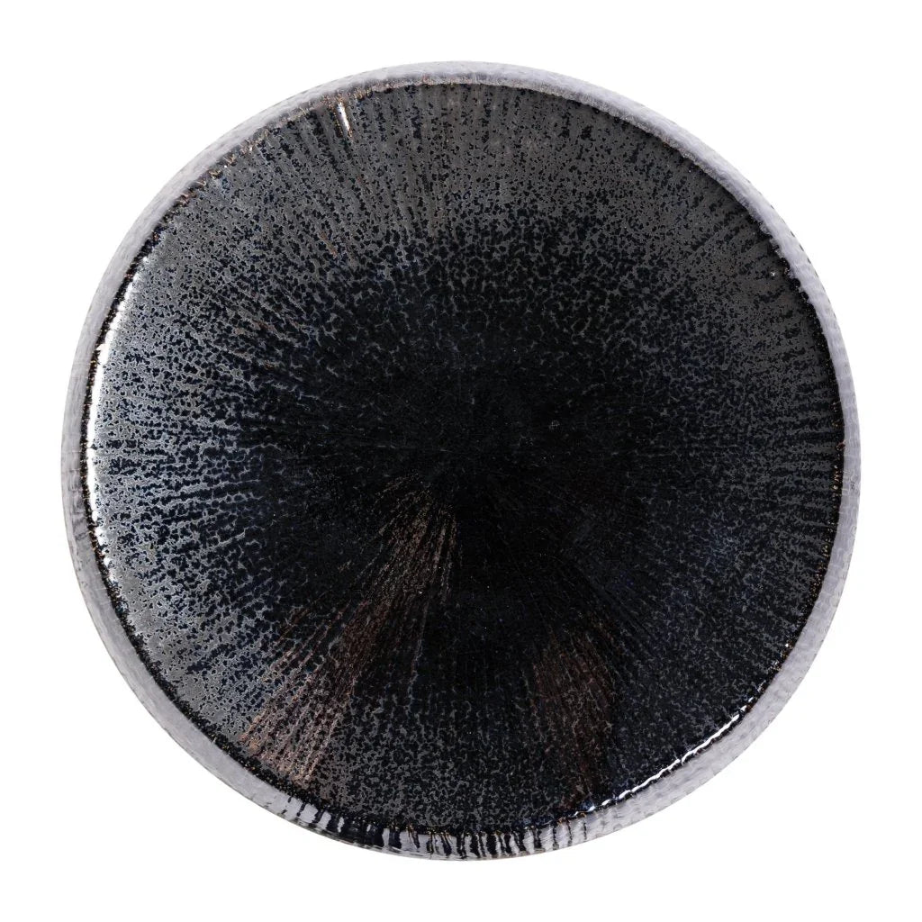 Close-up of a black stool top on a white background