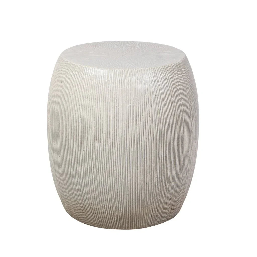 Round textured side table on a white background