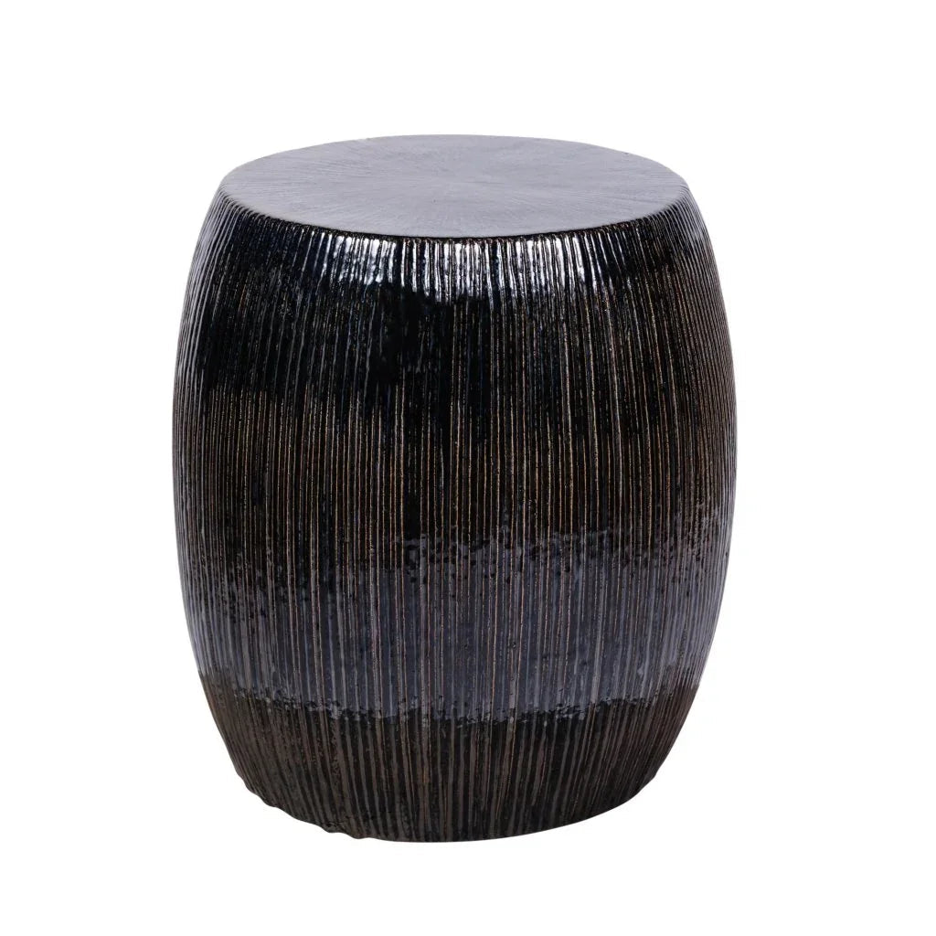 Black ribbed cylindrical stool on a white background