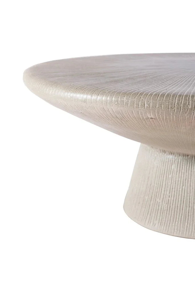 Round textured table on a white background