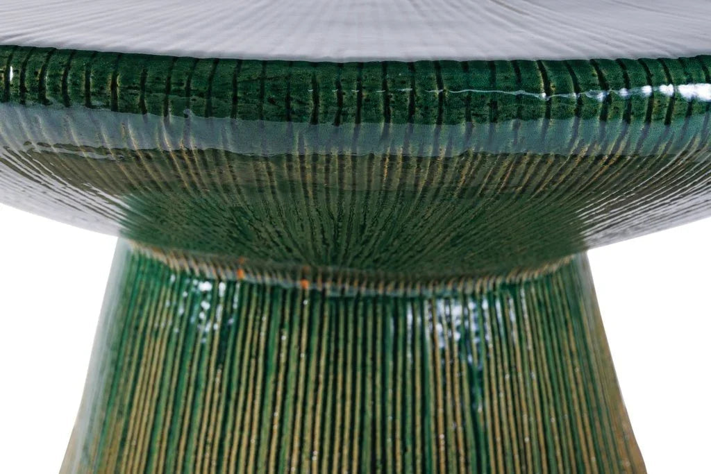 Close-up of a green woven chair with a white background