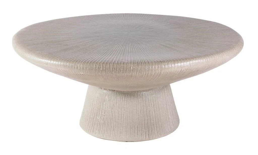 Round textured coffee table on a white background
