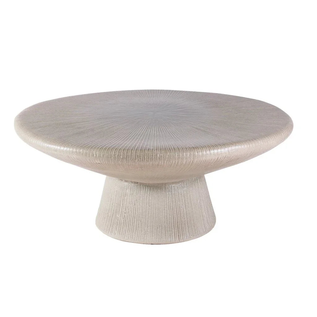 Round textured coffee table on a white background