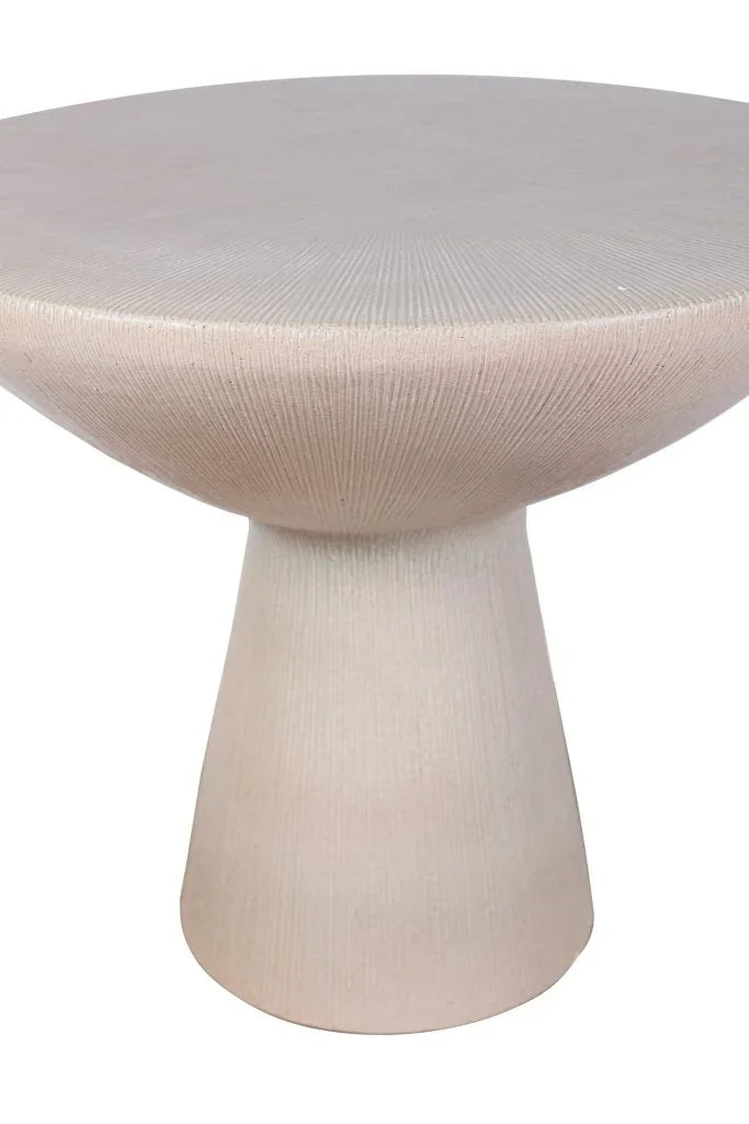 Modern accent table with textured surface and thin pedestal base on a white background
