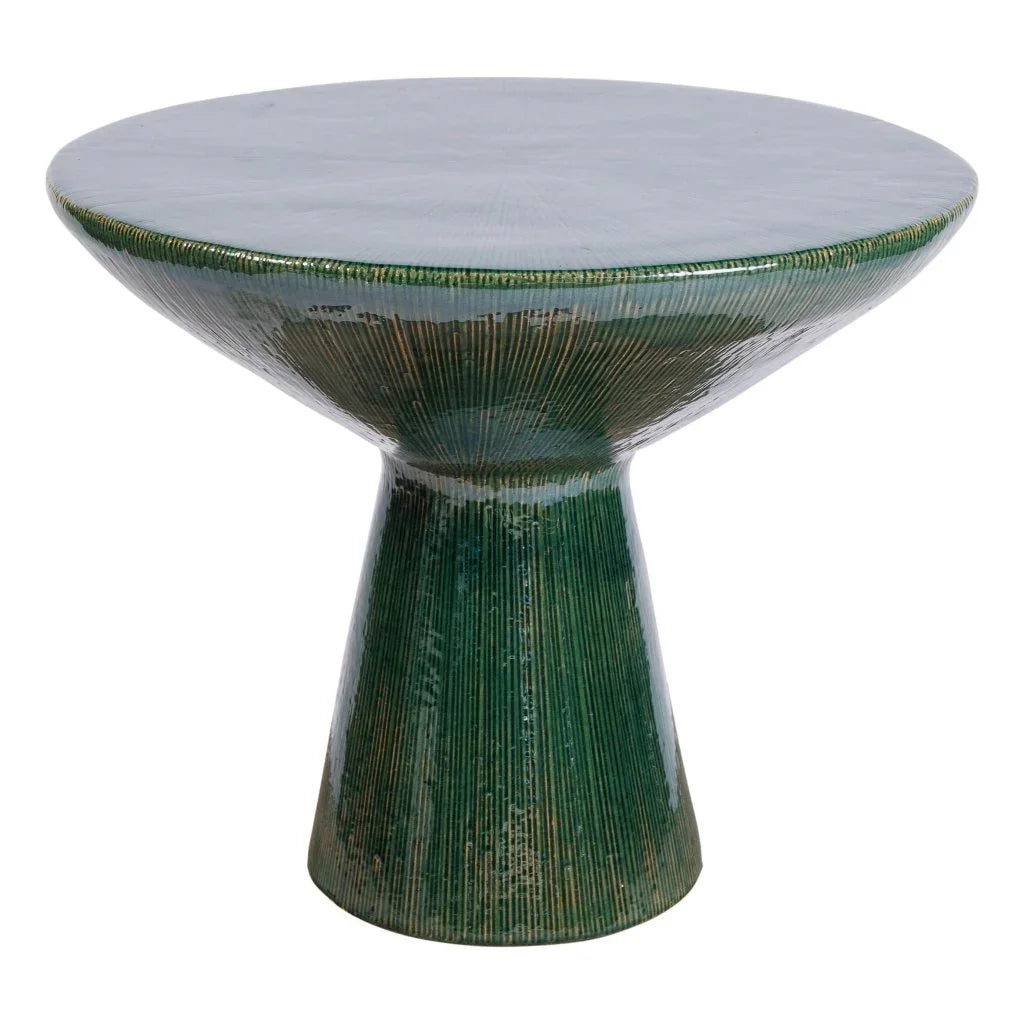 Green textured table with a white top on a white background
