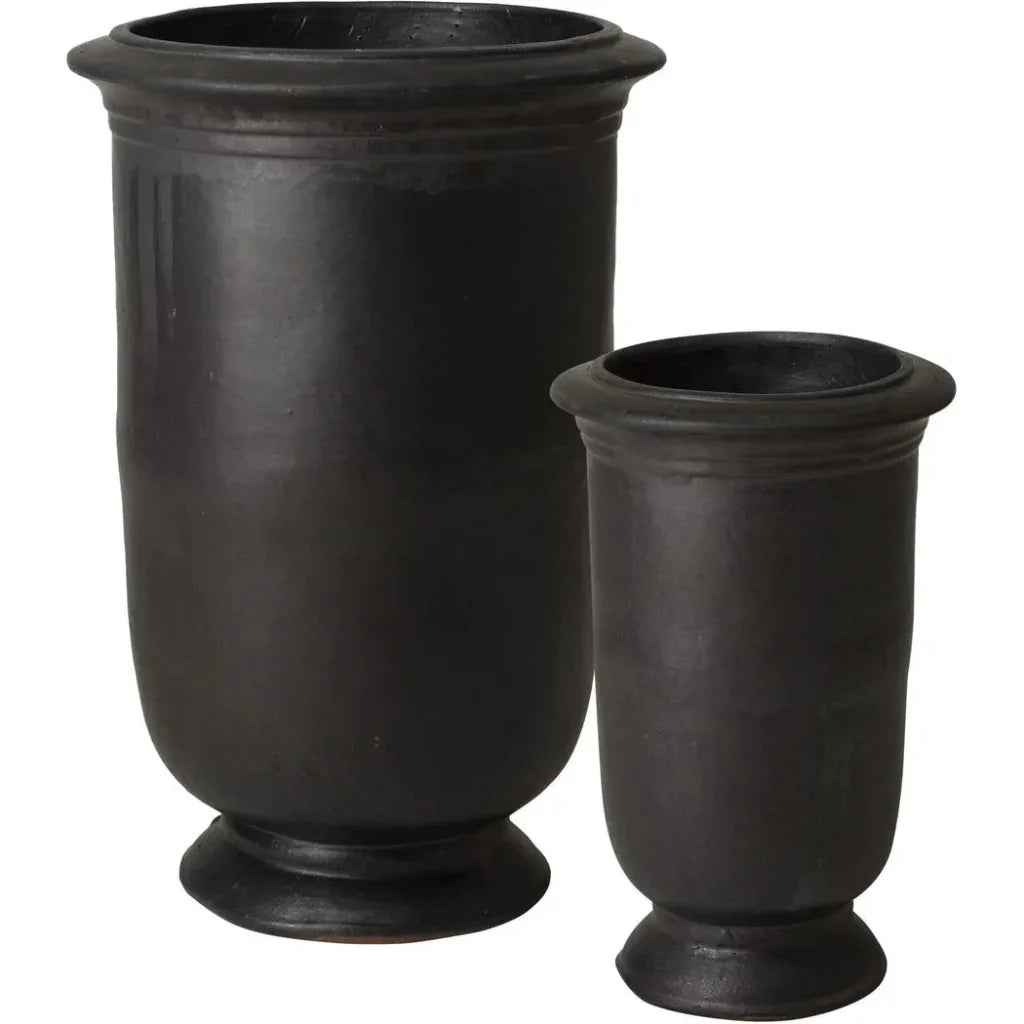 Two black urn-shaped planters on a white background
