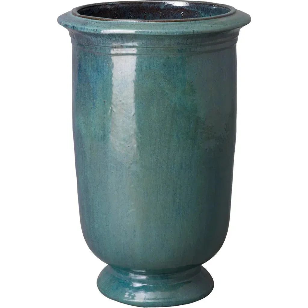 Teal ceramic planter on a white background