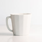White ceramic mug on a white background