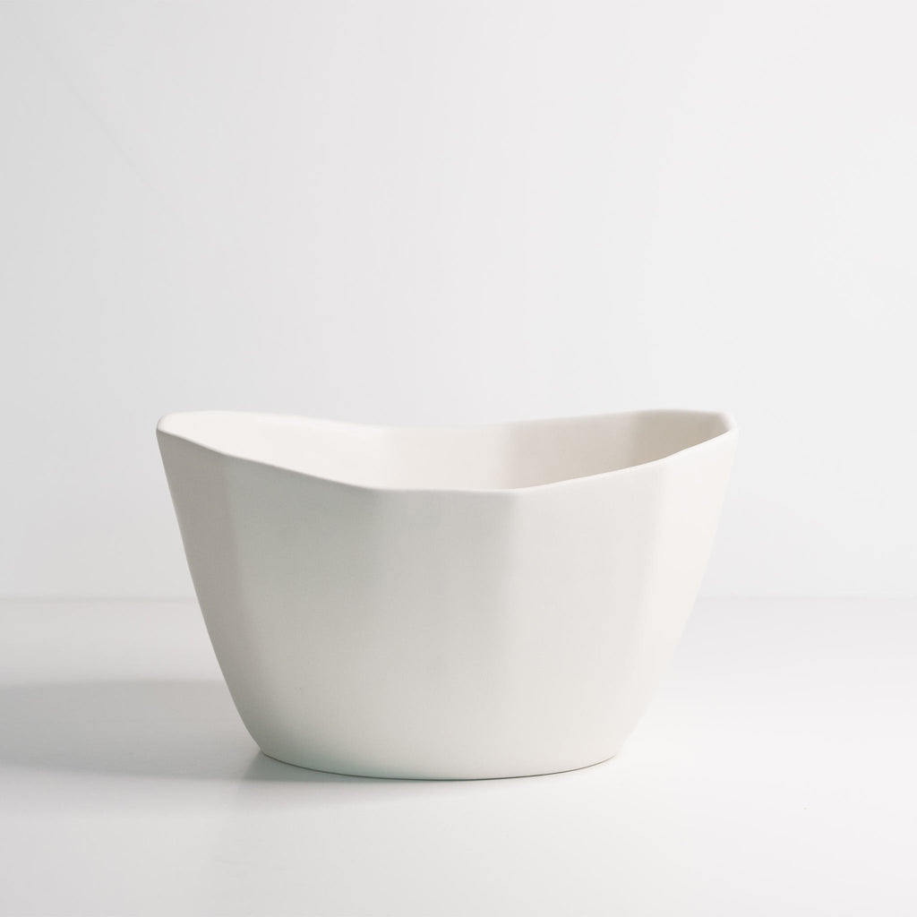 White ceramic bowl on a light gray background