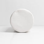 White spherical object on a light gray background