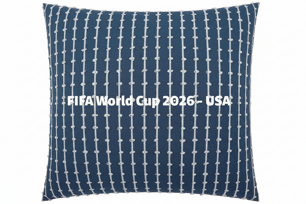 Navy blue pillow with white pattern and 'FIFA World Cup 2026 USA' text on a white background