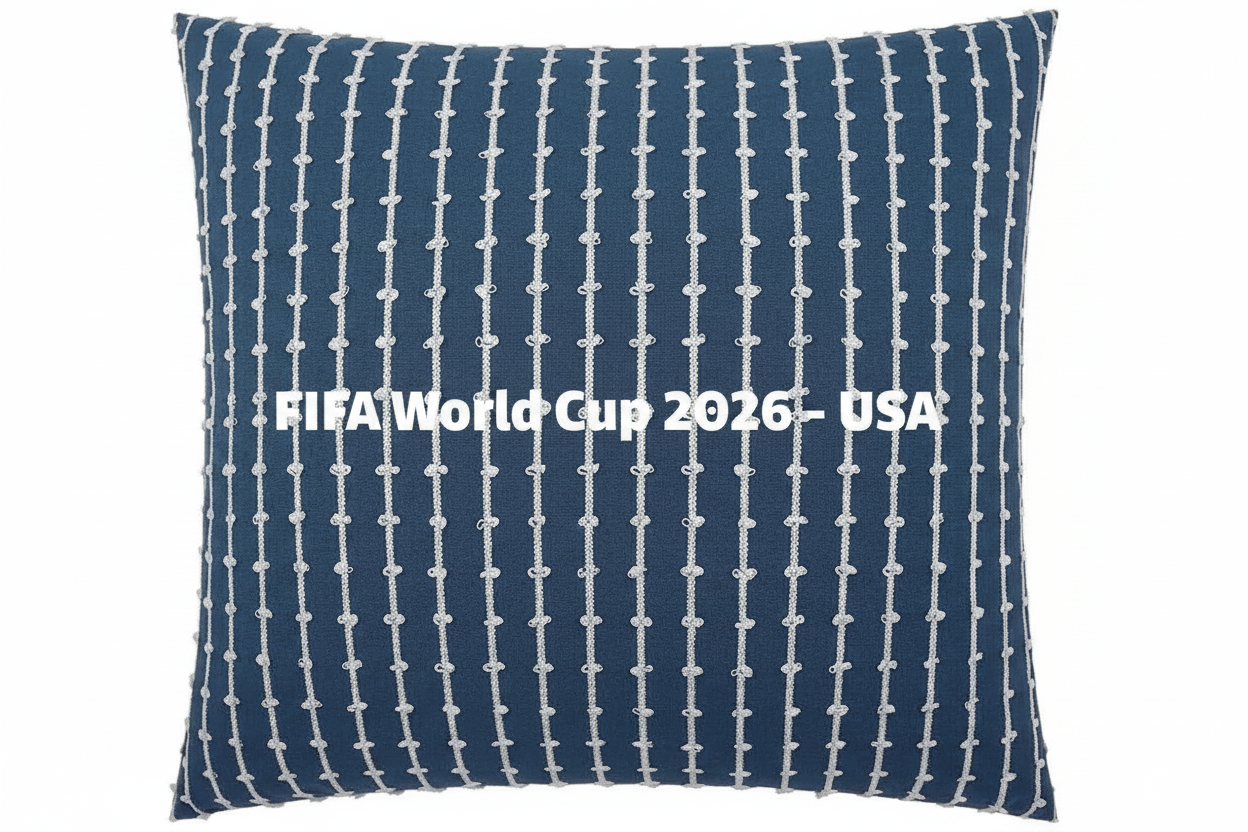 Navy blue pillow with white pattern and 'FIFA World Cup 2026 USA' text on a white background