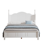 White bed with bedding on a white background