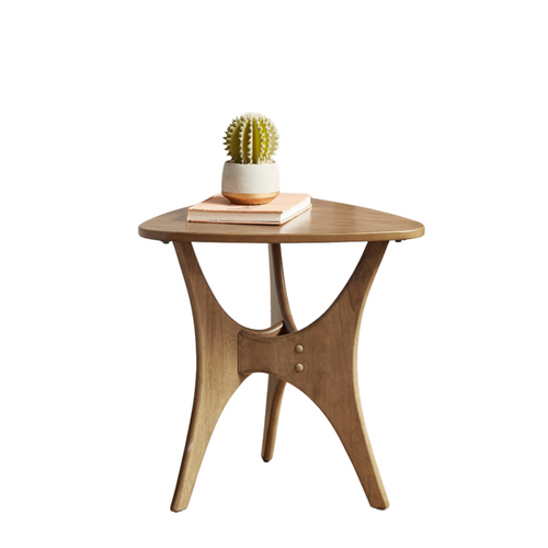 Wooden side table with a cactus and books on a white background