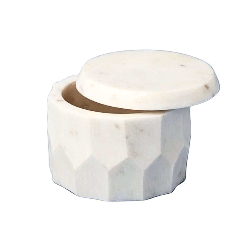 Marble hexagonal container with a lid on a white background