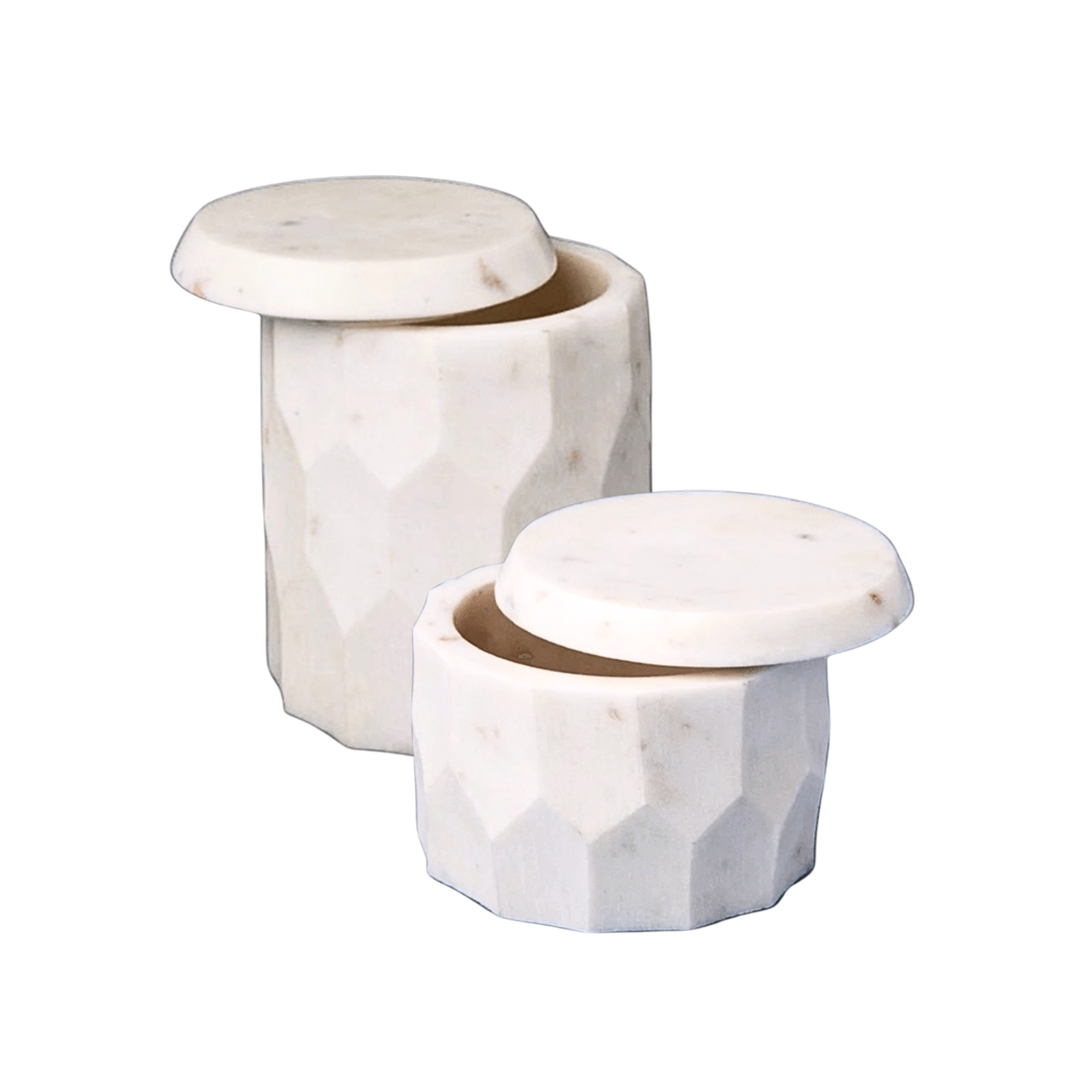Two marble containers with faceted designs on a white background