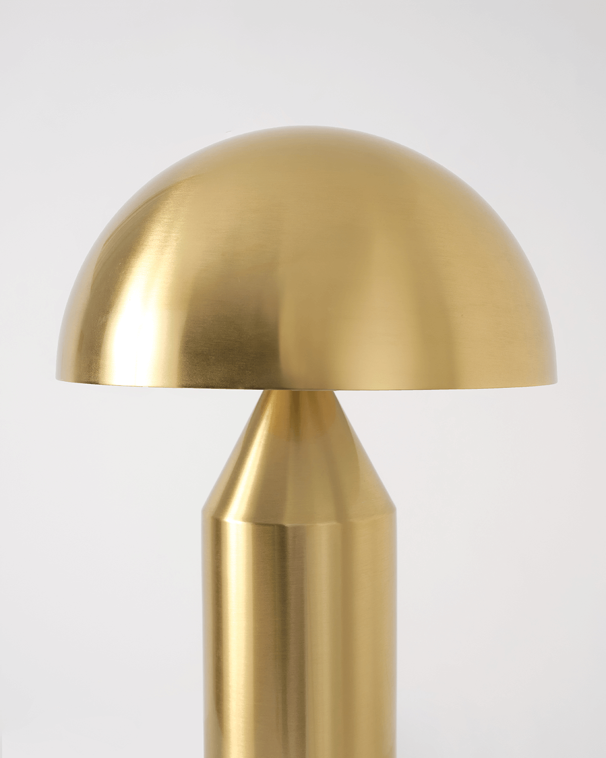 Gold table lamp with a white background