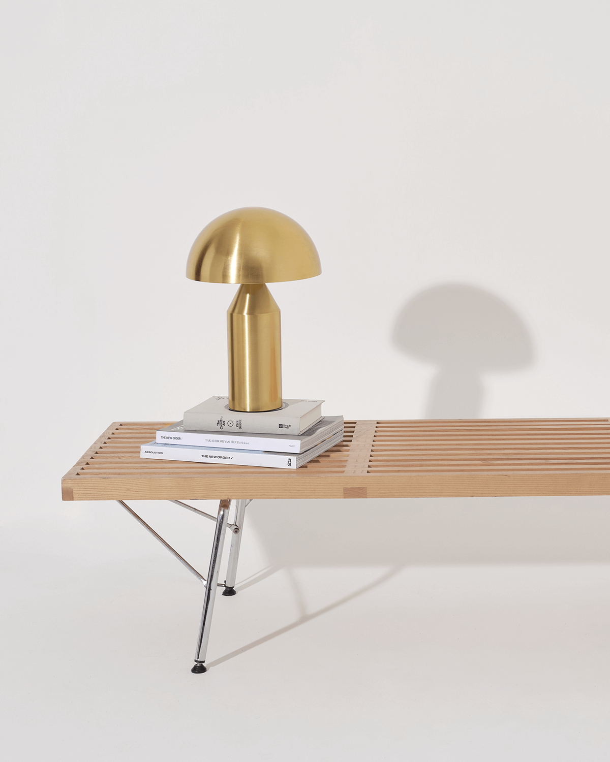 Gold lamp on a wooden table with a white background