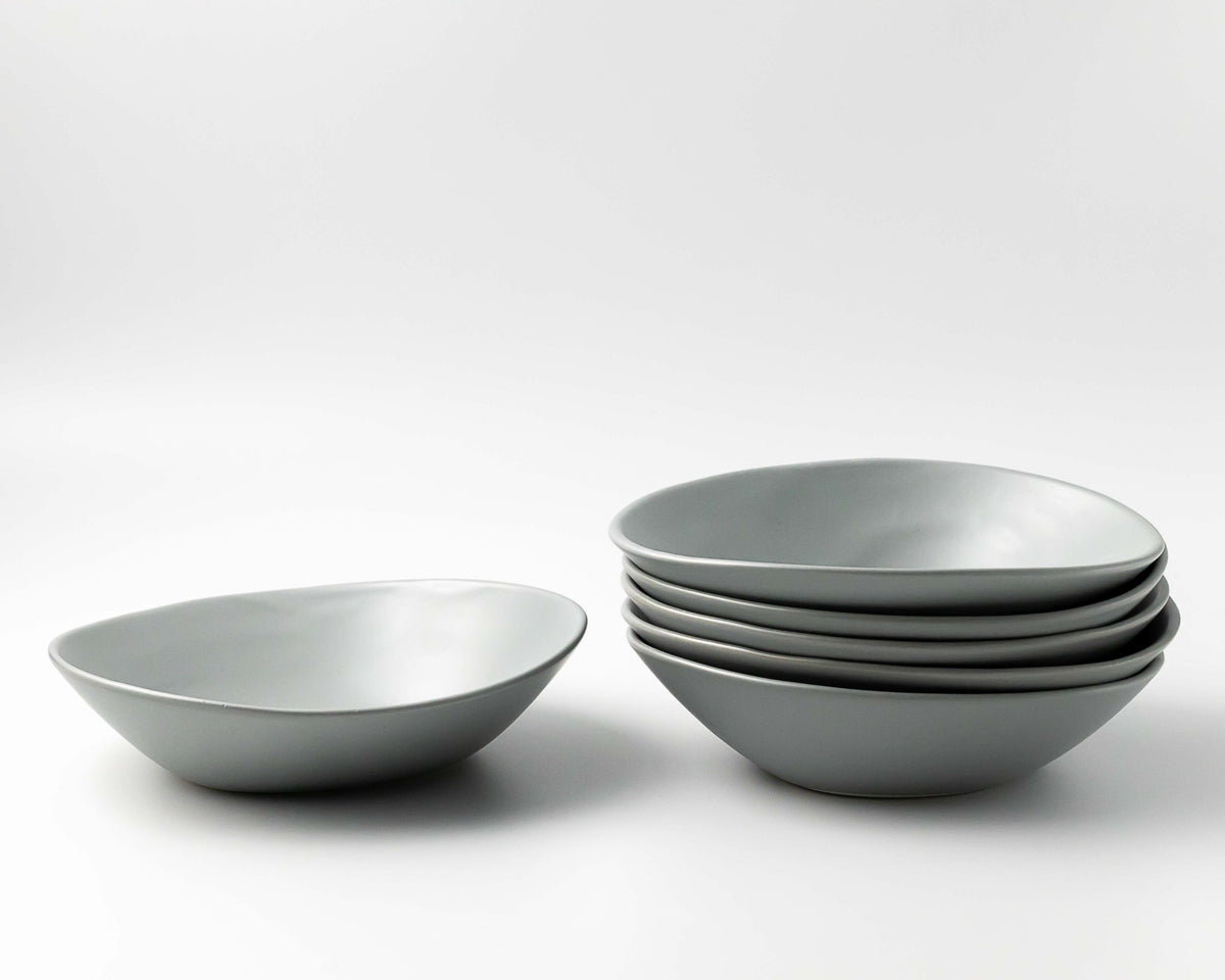 Set of gray ceramic bowls on a white background