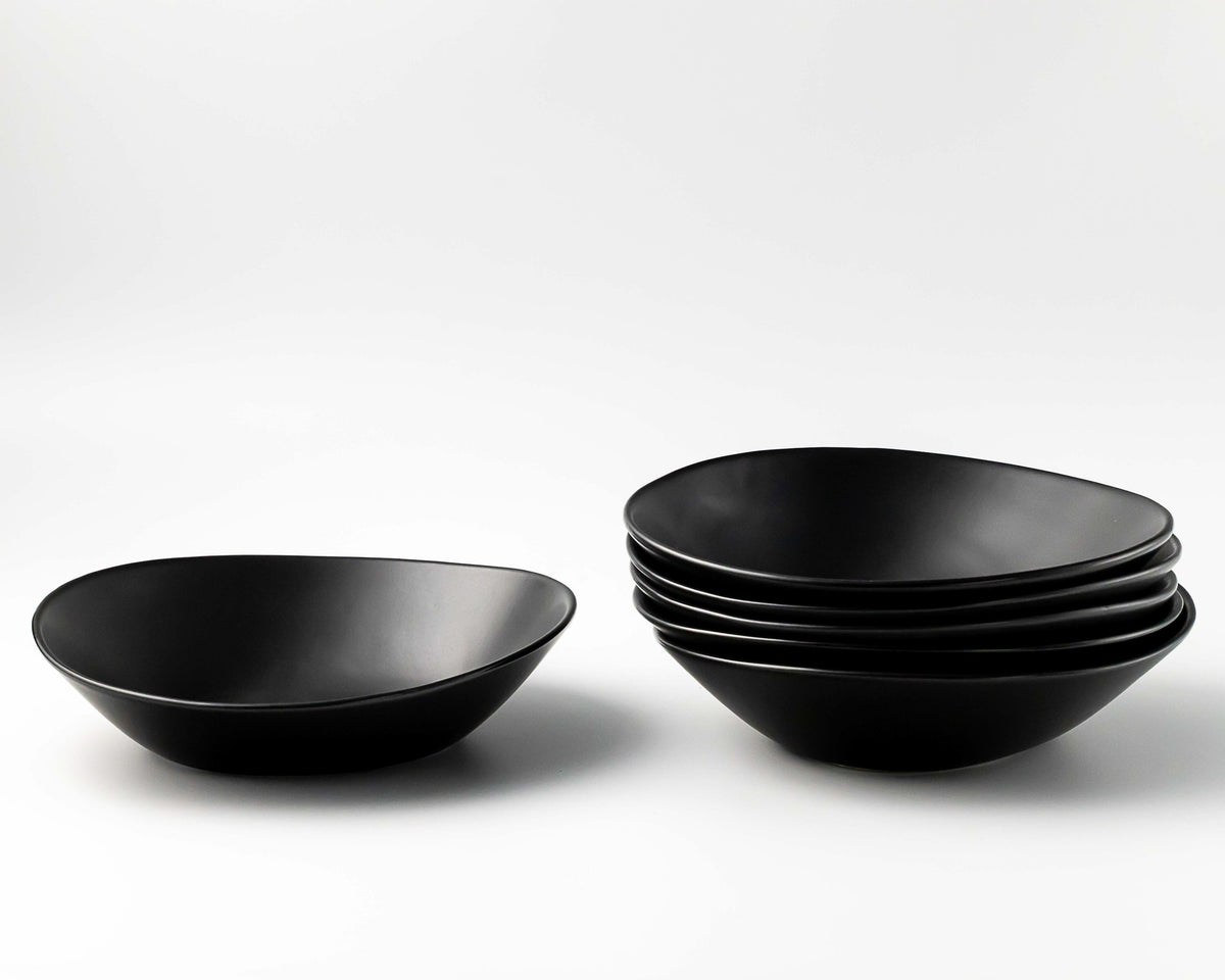 Set of black bowls on a white background