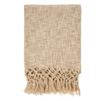 Beige textured throw blanket with fringes on a white background