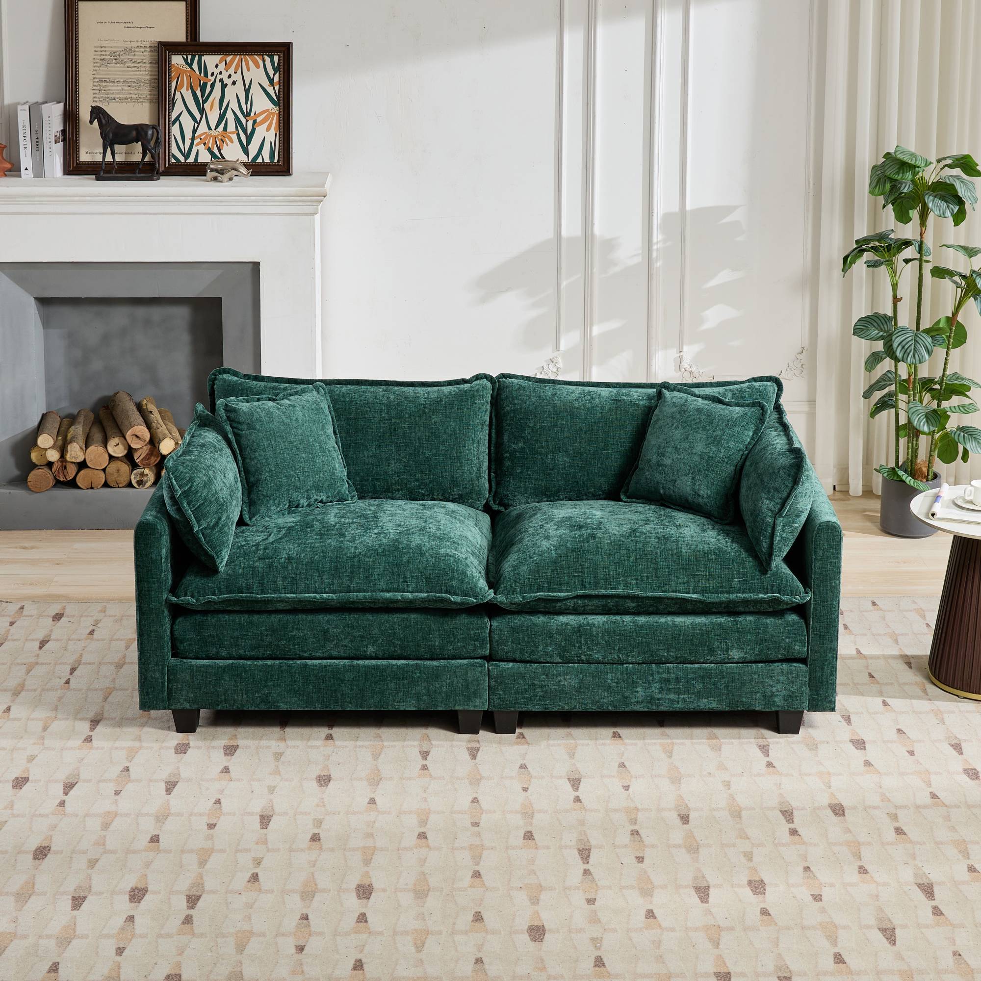 Green velvet sofa in a living room setting with a fireplace and decor.