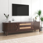 Wooden TV stand with a television mounted on a white wall, featuring decorative items.