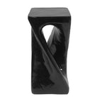 Black twisted side table on a white background