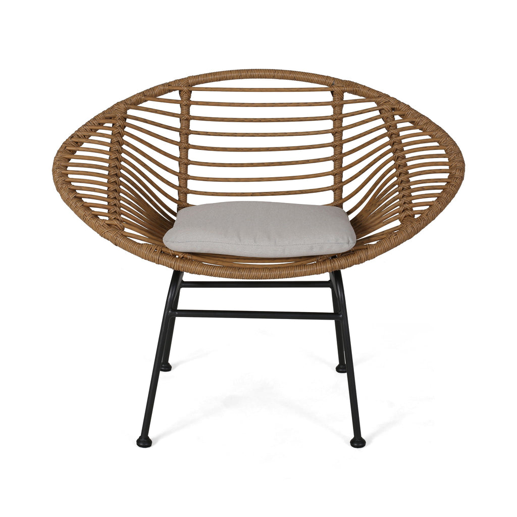 Wicker chair with a cushion on a white background