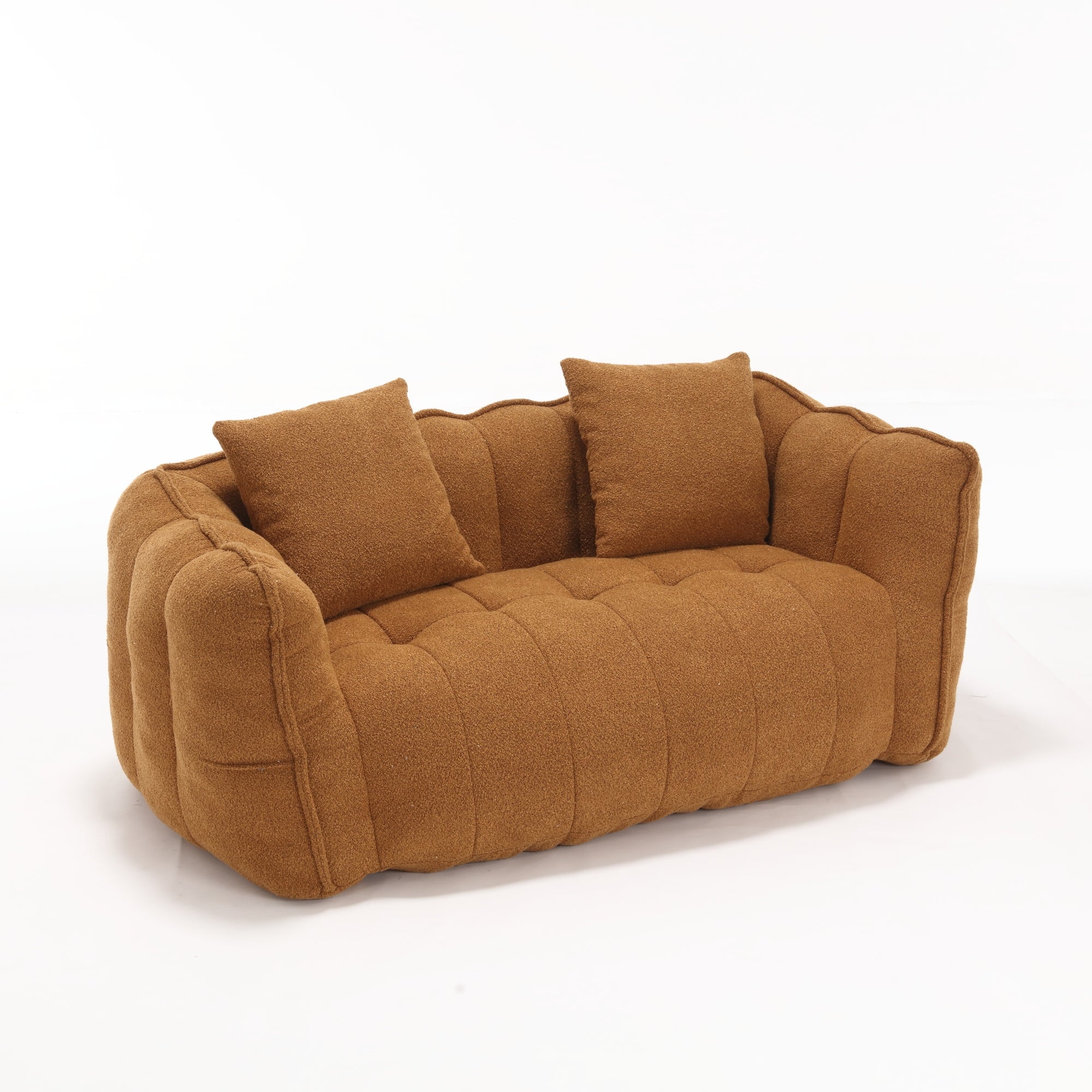Brown sofa with two cushions on a white background