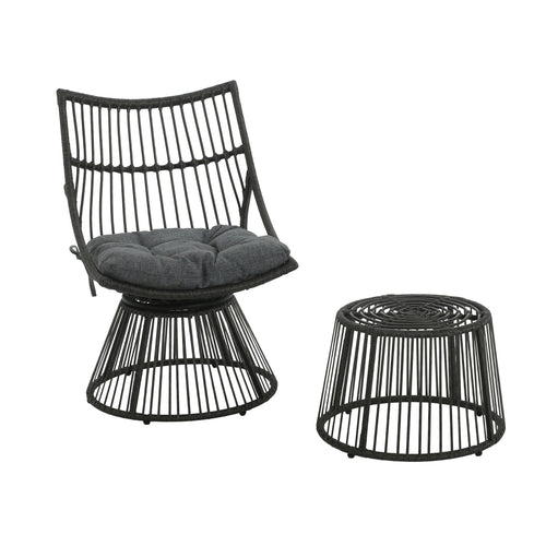 Black rattan chair with cushion and matching side table on a white background