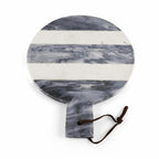 Round marble serving board with alternating white and gray marbled horizontal stripes and a dark brown leather hanging cord, shown on a white background.