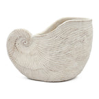 Decorative ceramic vase with textured surface on a white background