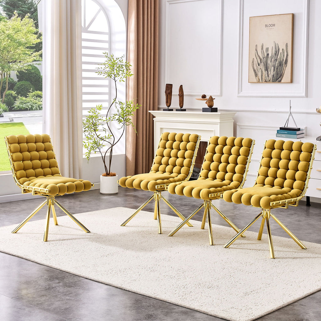 Four yellow chairs with gold legs arranged in a living room setting.