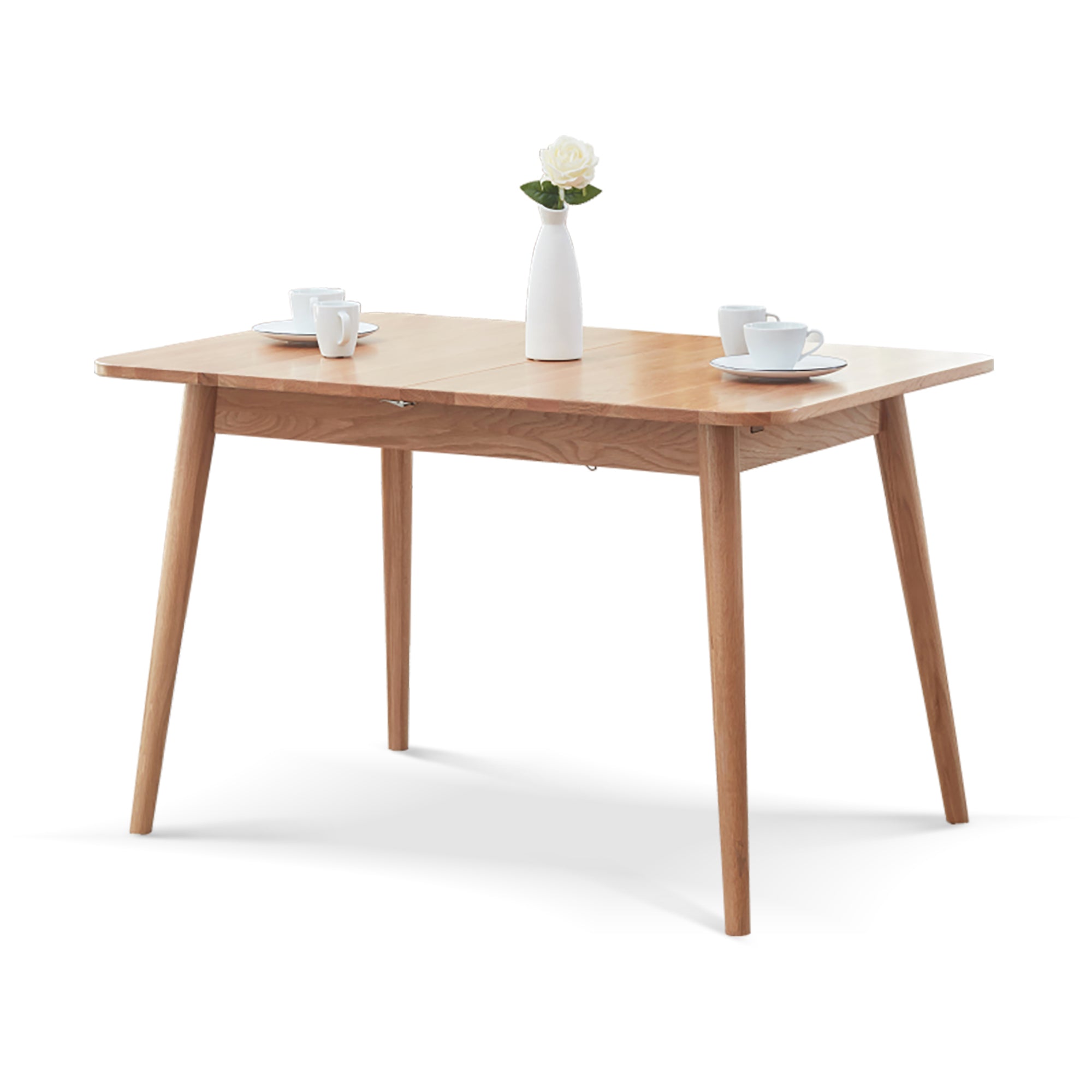 Wooden dining table with white vase and cups on a white background