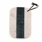Marble cutting board with a dark stripe and brown handle on a white background