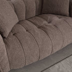 Close-up of a brown textured sofa with tufted design