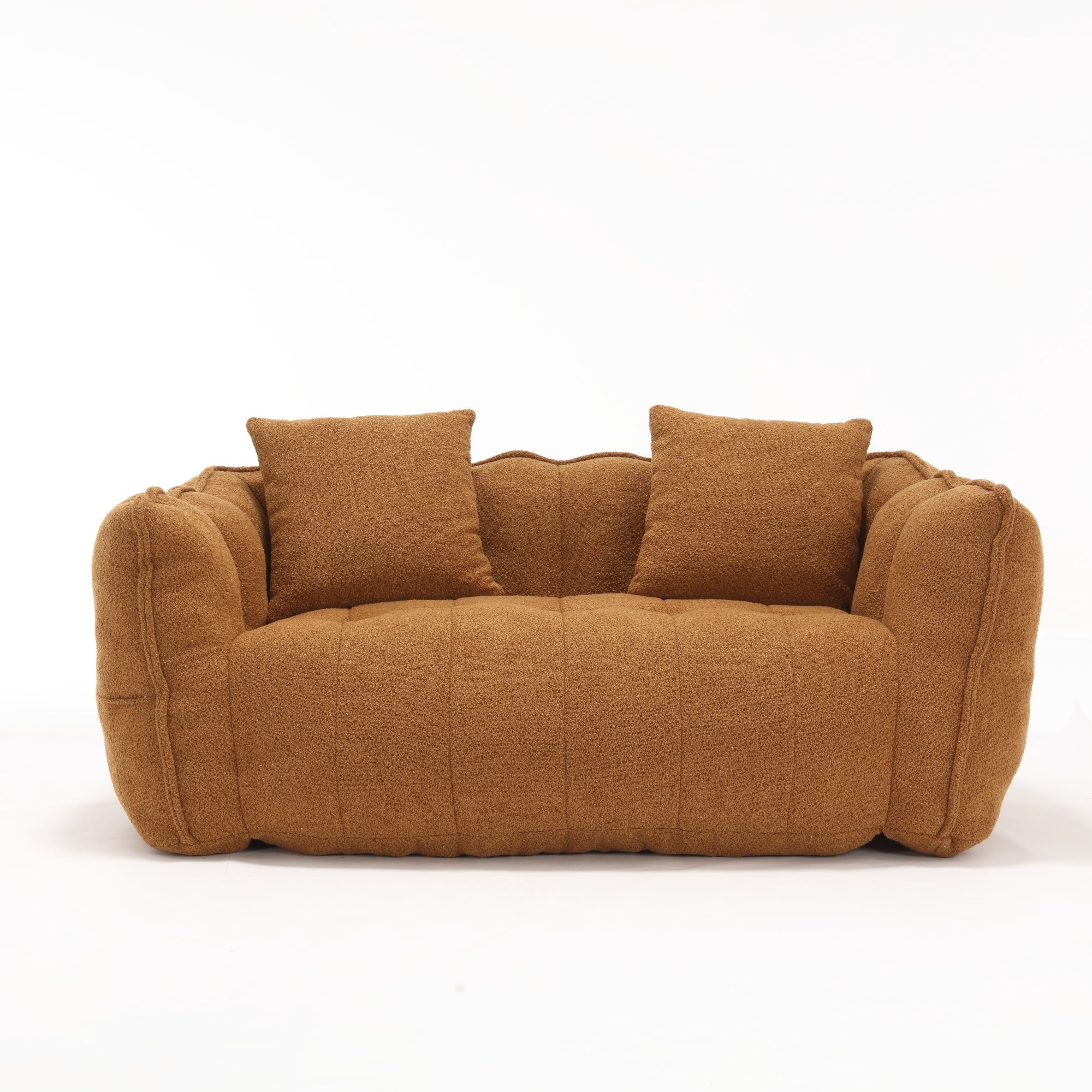 Brown sofa with two cushions on a white background