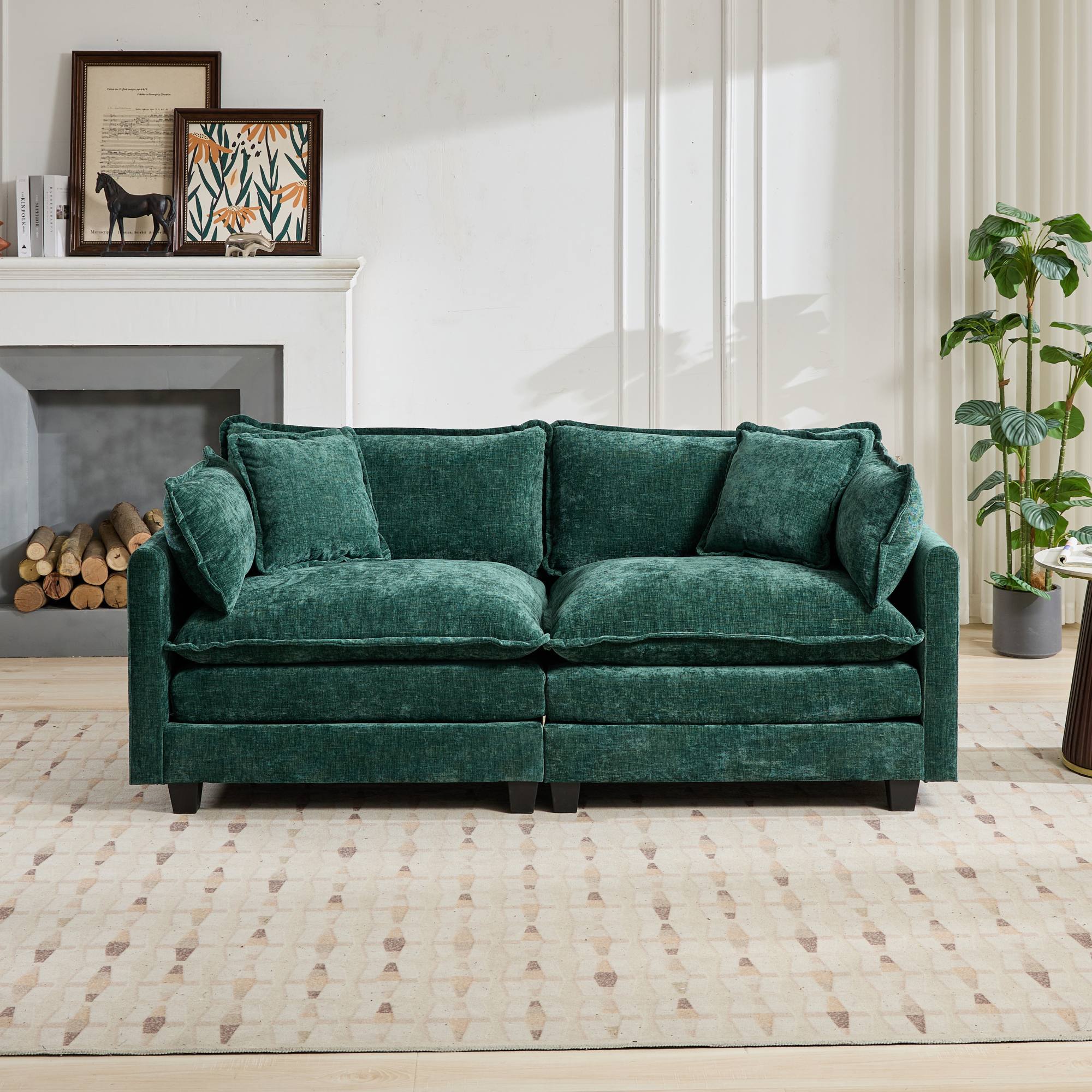 Green sofa in a living room setting with a fireplace and decor.