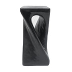 Black abstract sculpture table on a white background