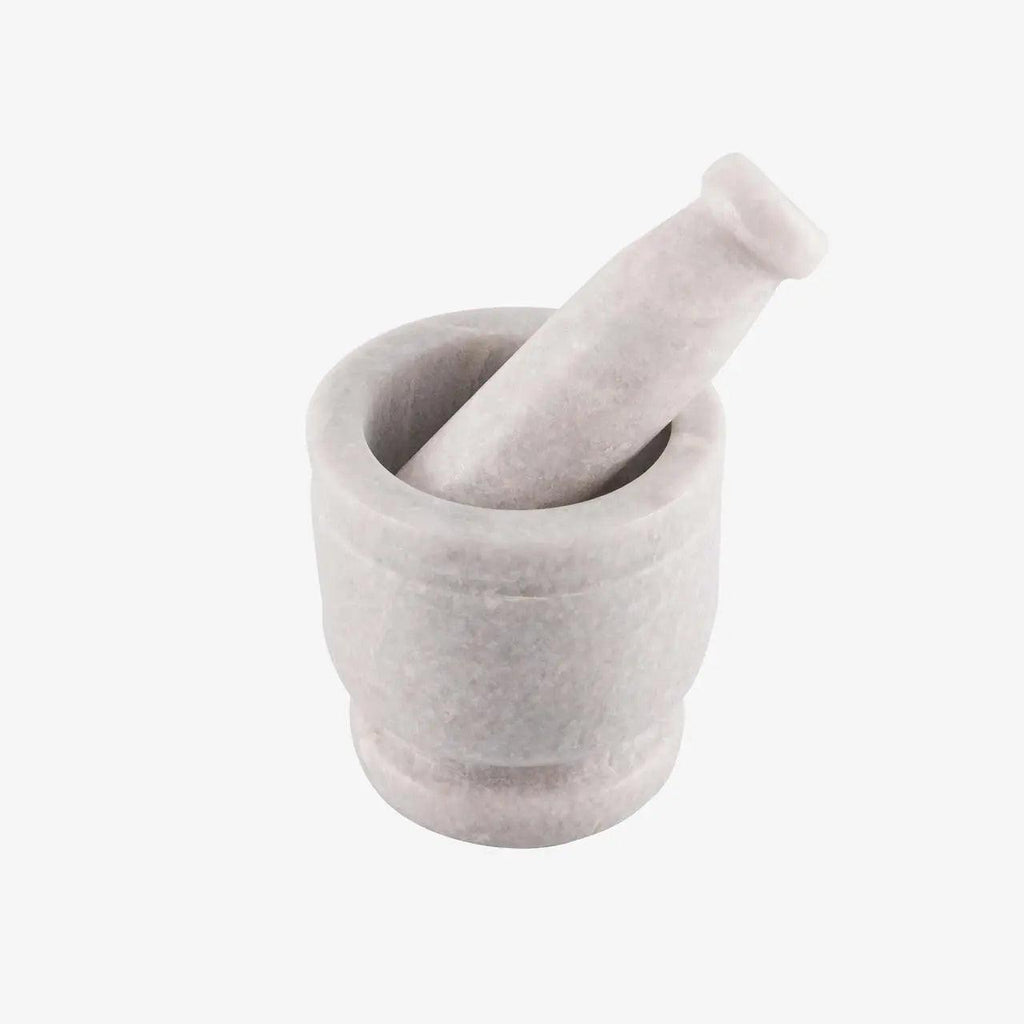 White marble mortar and pestle on a white background