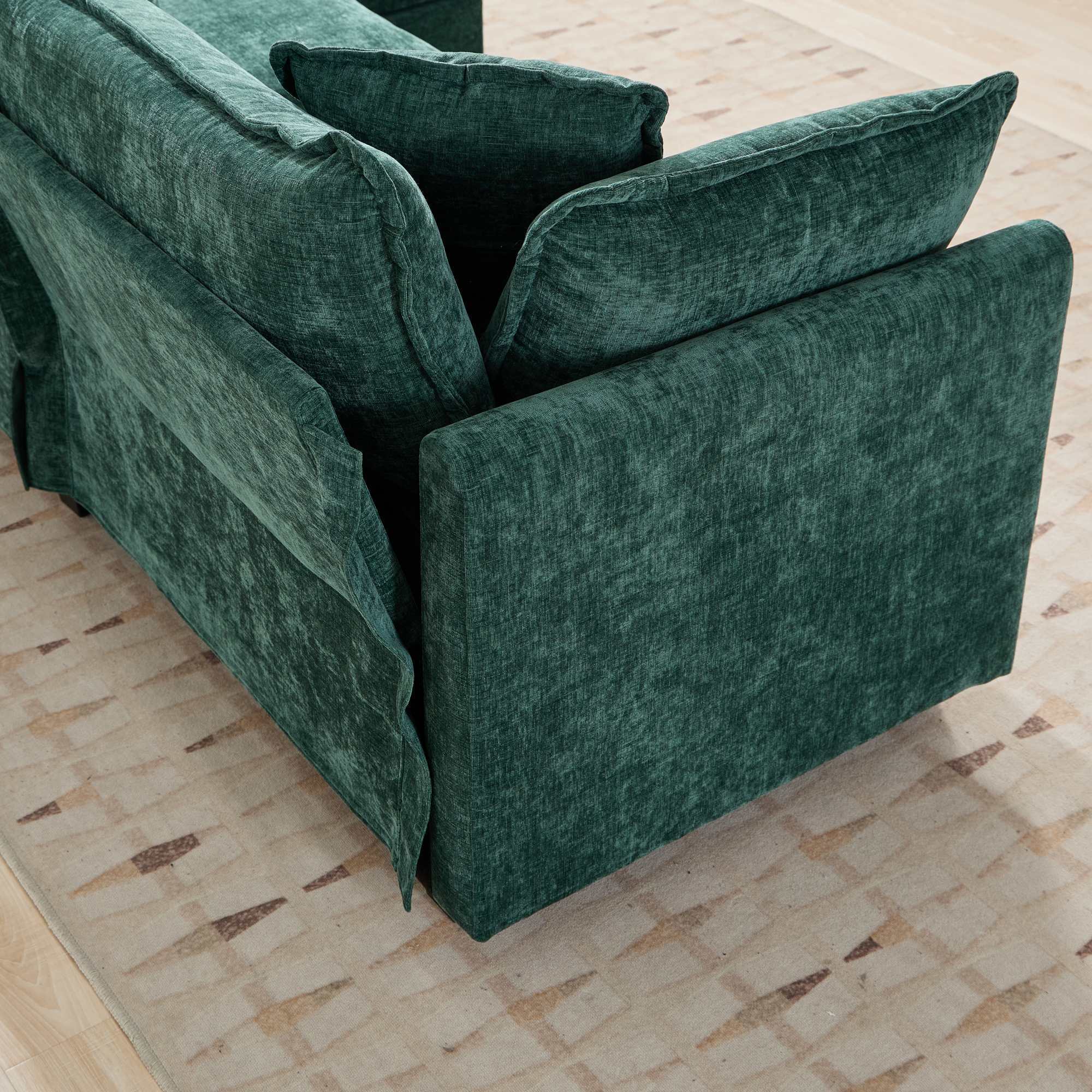 Green velvet sofa on a beige carpet