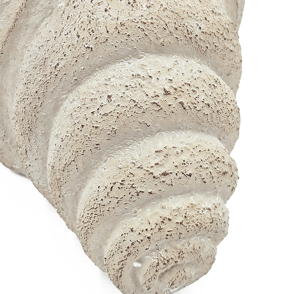 Close-up of a textured vase on a white background