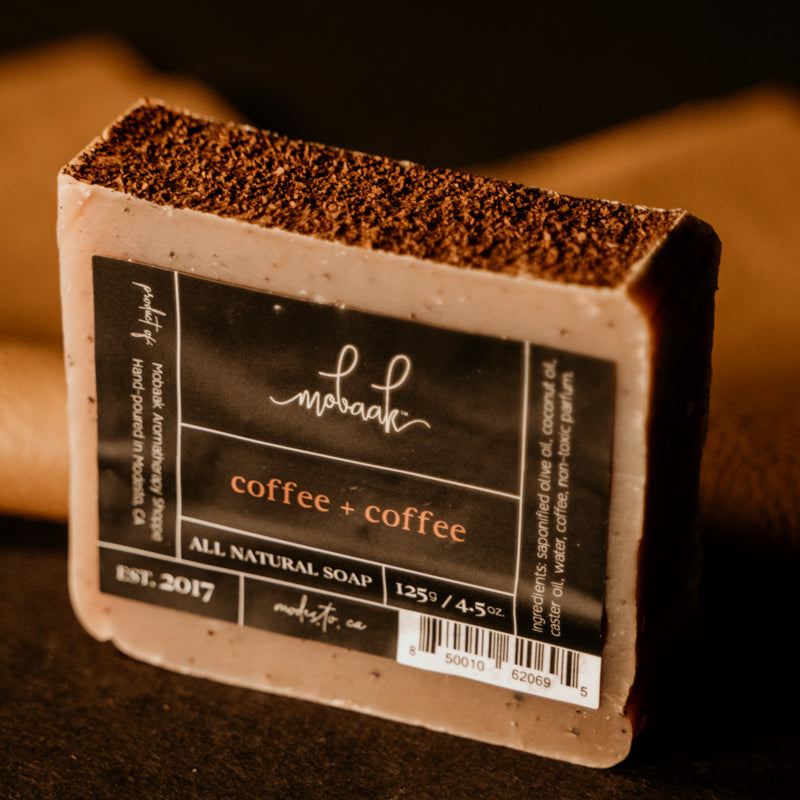 Bar of soap with a label on a dark background
