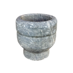 Stone mortar on a white background